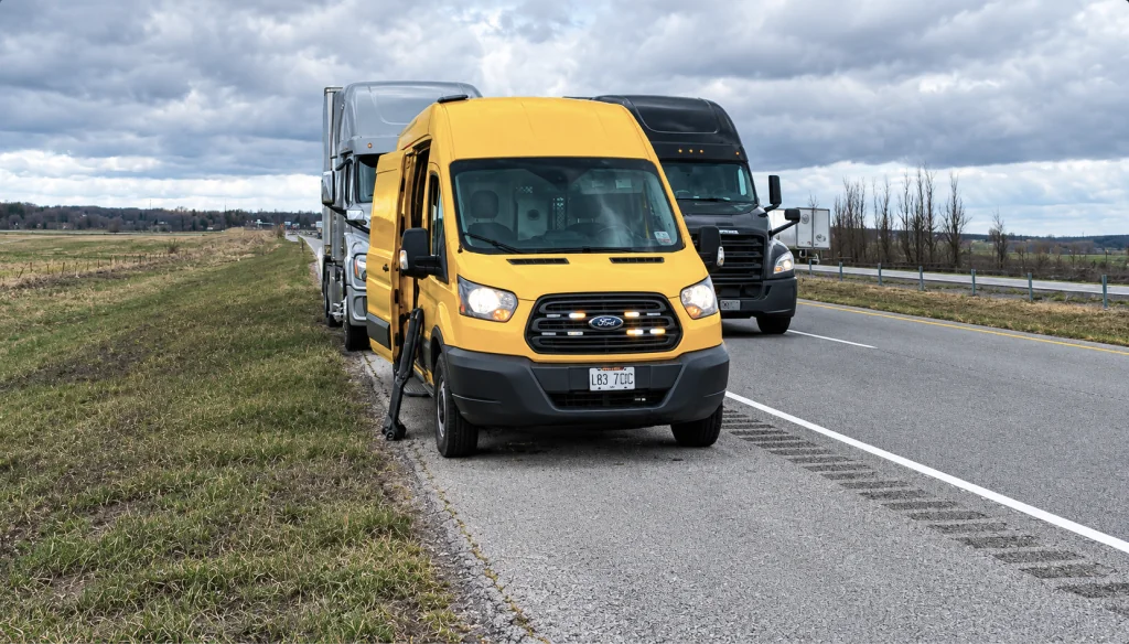 Sokil’s yellow mobile service van beside a truck on the roadside